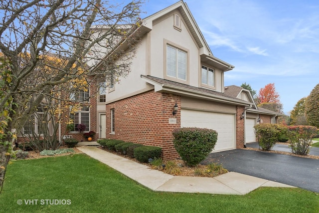 view of home's exterior with a garage and a lawn