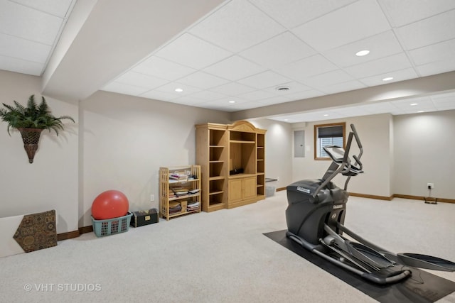 workout room with carpet and a drop ceiling