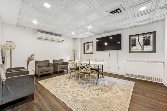 dining room featuring recessed lighting, an AC wall unit, dark wood-style floors, radiator heating unit, and an ornate ceiling