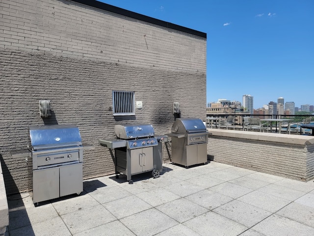 view of patio / terrace featuring a city view and area for grilling