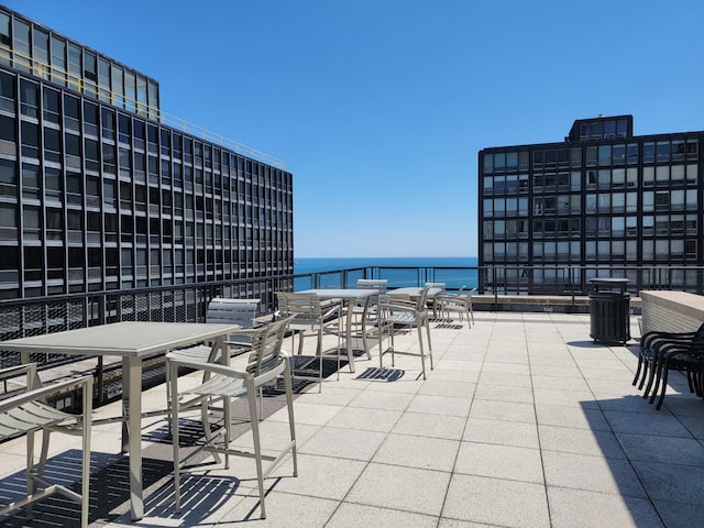 view of patio with a water view