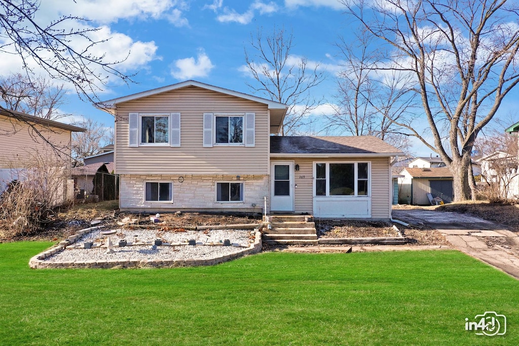 split level home with a front yard