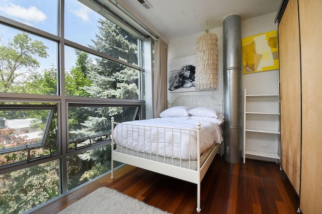 bedroom featuring dark wood-type flooring