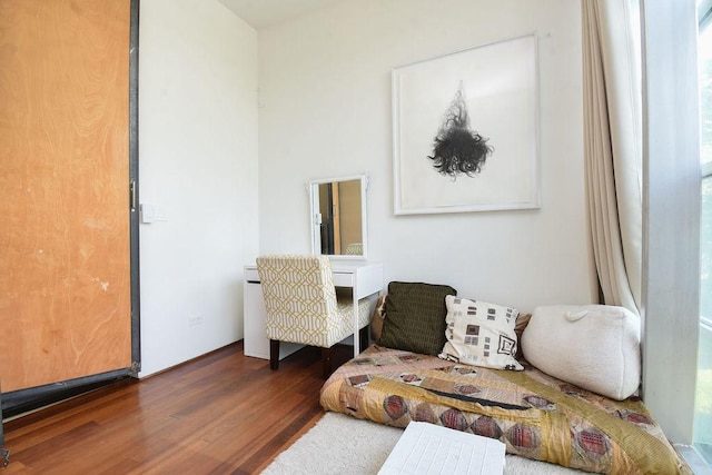 sitting room with dark hardwood / wood-style flooring