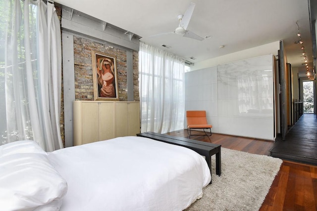 bedroom featuring dark hardwood / wood-style floors and ceiling fan