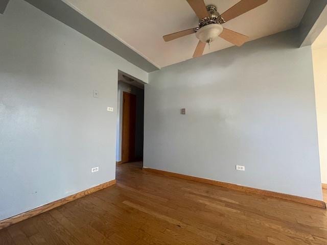 spare room featuring hardwood / wood-style floors and ceiling fan