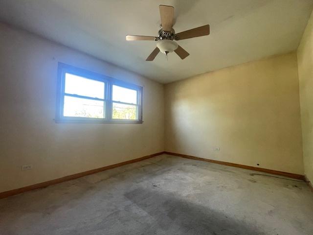 carpeted empty room with ceiling fan