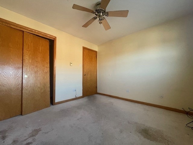 unfurnished bedroom with light carpet and ceiling fan