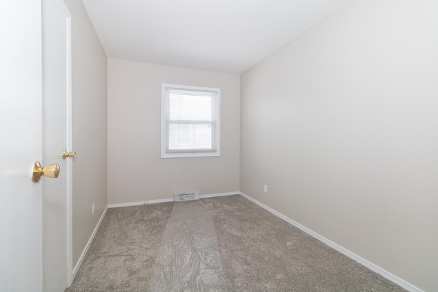 empty room featuring light colored carpet