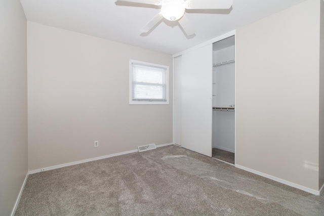 unfurnished bedroom with ceiling fan, a closet, and light colored carpet