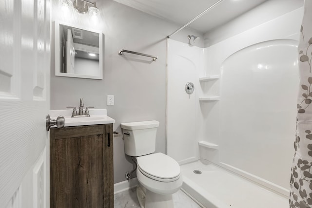 bathroom featuring a shower with curtain, toilet, and vanity