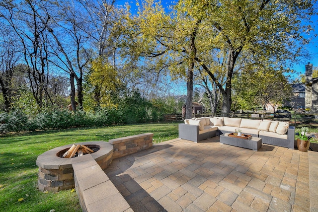 view of patio / terrace featuring an outdoor living space with a fire pit