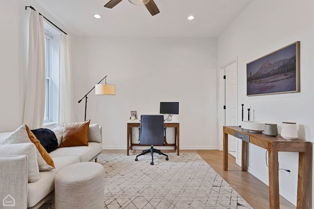 office featuring ceiling fan and light hardwood / wood-style floors