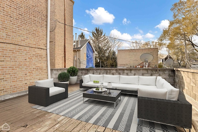 wooden terrace featuring an outdoor hangout area