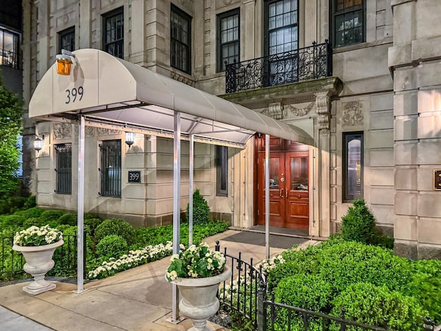 doorway to property featuring a balcony