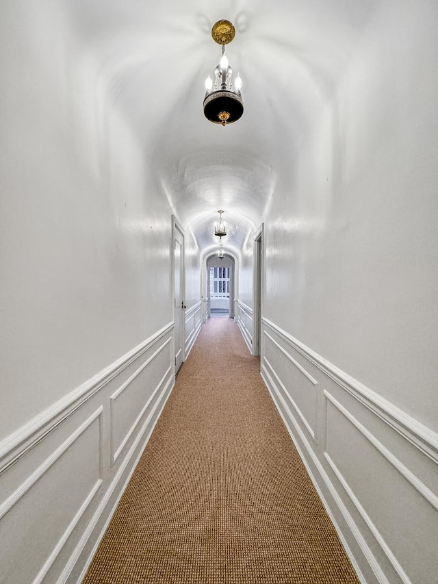 hallway with carpet flooring