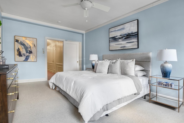 bedroom with ceiling fan, ornamental molding, and light carpet