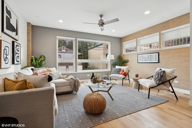 living room with hardwood / wood-style floors and ceiling fan