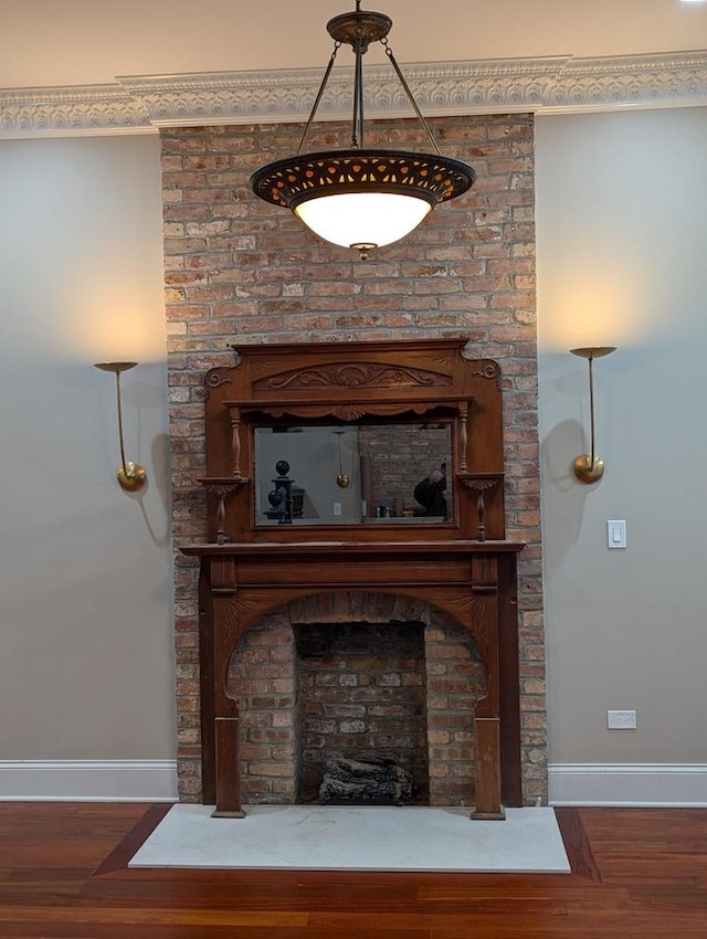 room details with hardwood / wood-style flooring and a fireplace