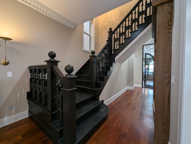 stairway featuring wood-type flooring