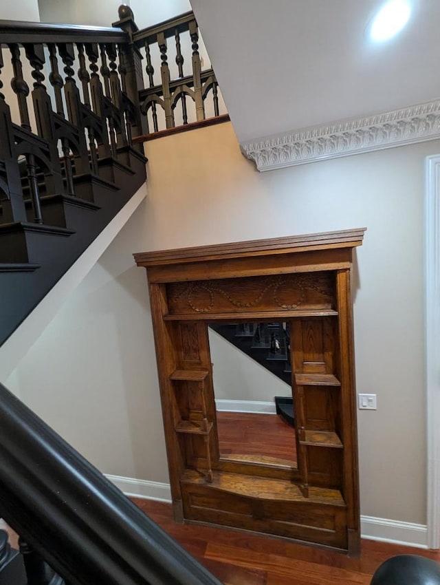 staircase featuring hardwood / wood-style flooring