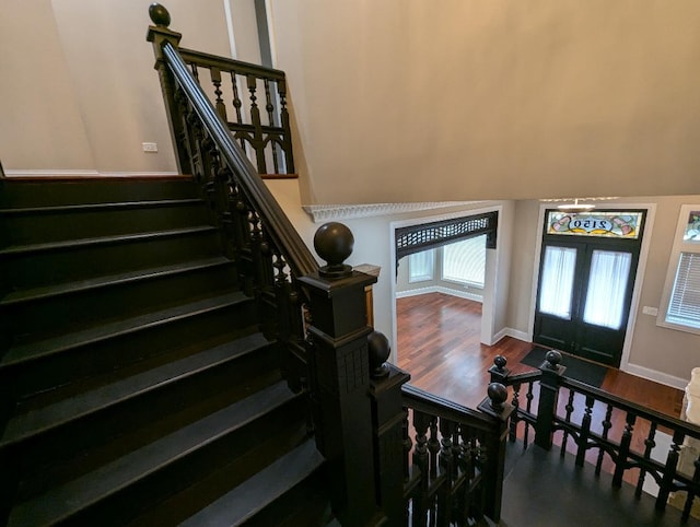 entrance foyer with french doors and wood-type flooring