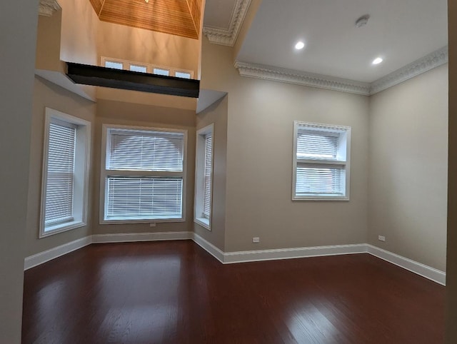 foyer entrance featuring dark hardwood / wood-style floors and crown molding