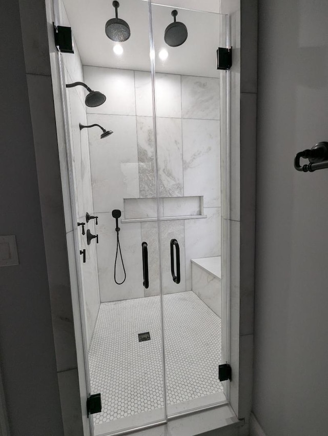 bathroom with a shower with shower door