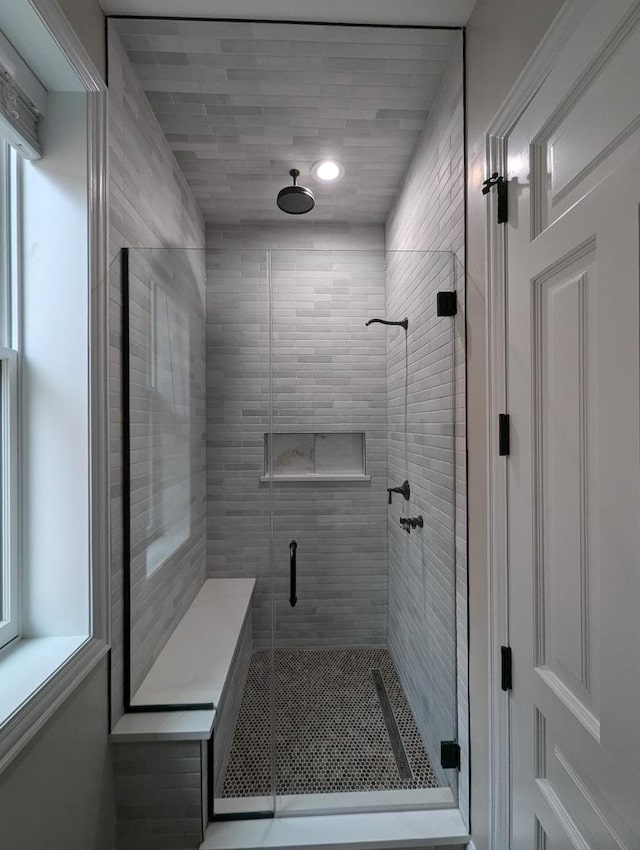 bathroom featuring an enclosed shower