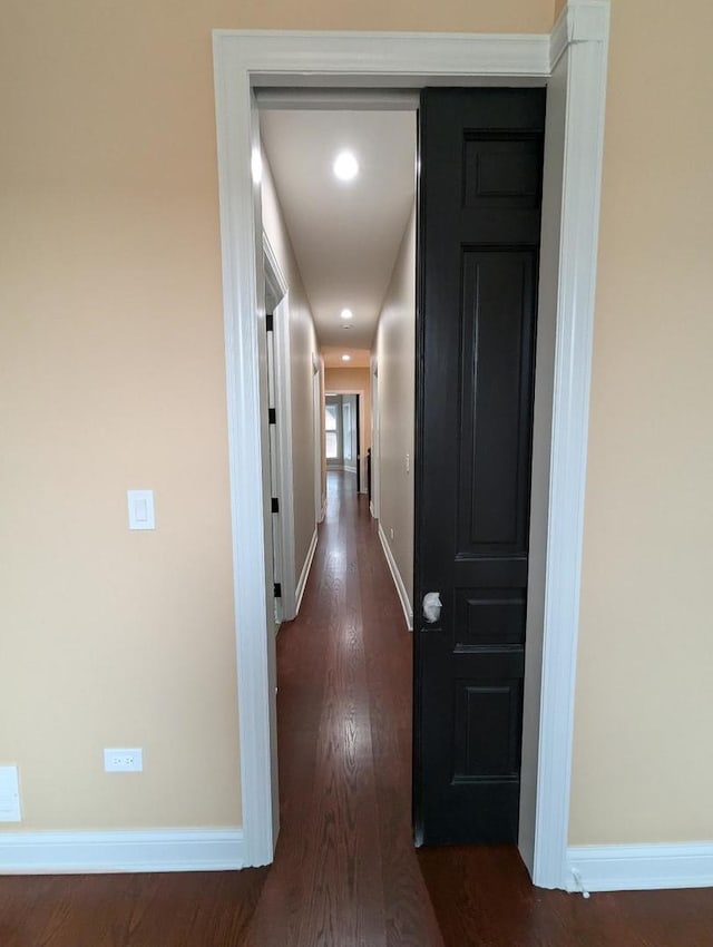 hall with dark hardwood / wood-style flooring