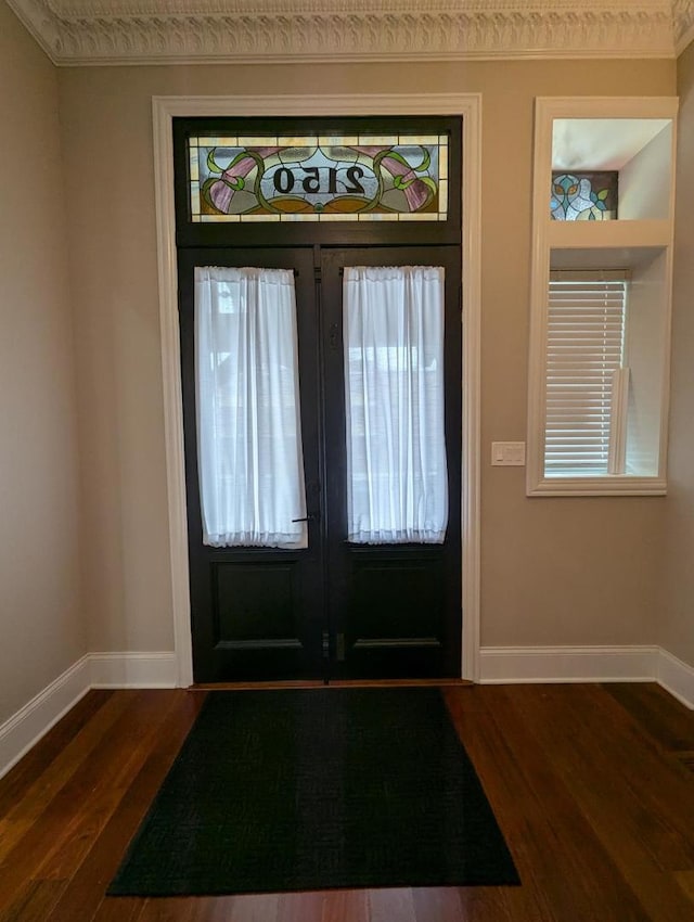 foyer entrance featuring french doors and dark wood-type flooring