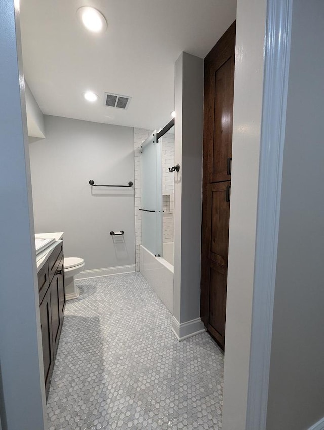 full bathroom with shower / bath combination with glass door, vanity, and toilet