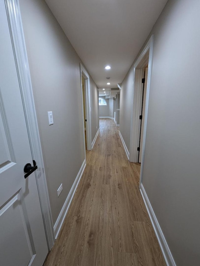 corridor featuring light hardwood / wood-style flooring