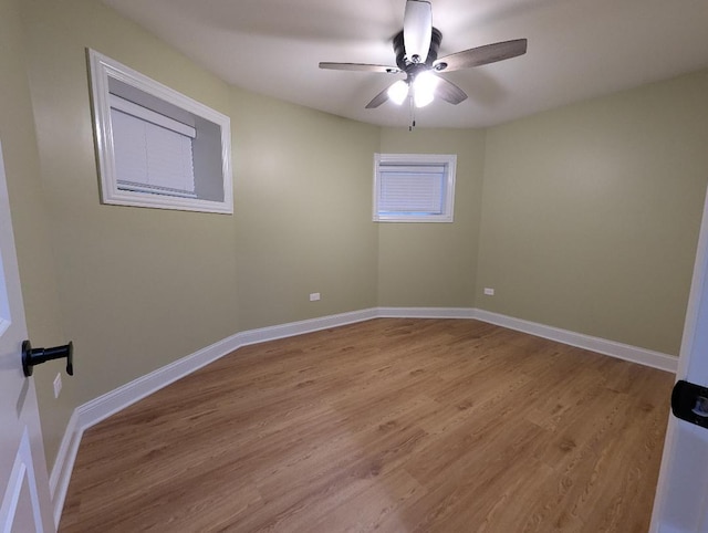 spare room featuring light hardwood / wood-style flooring and ceiling fan