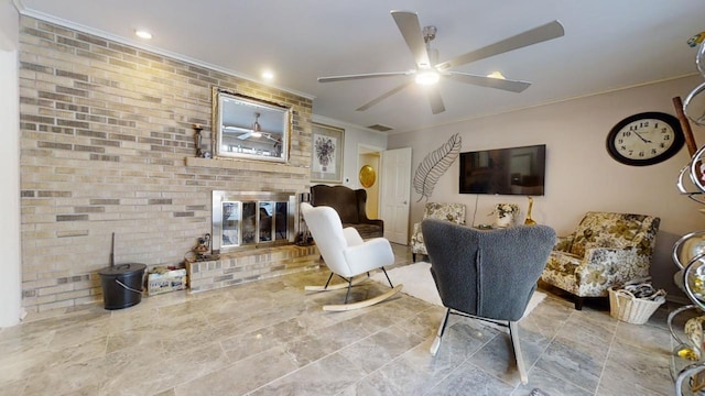 interior space featuring a brick fireplace, brick wall, ceiling fan, and crown molding