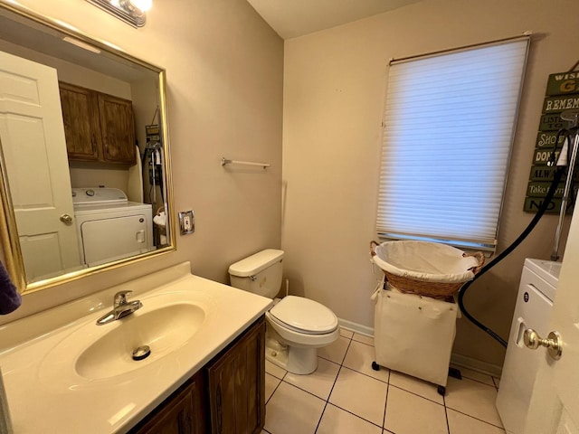 bathroom featuring toilet, washer / clothes dryer, tile patterned floors, and vanity