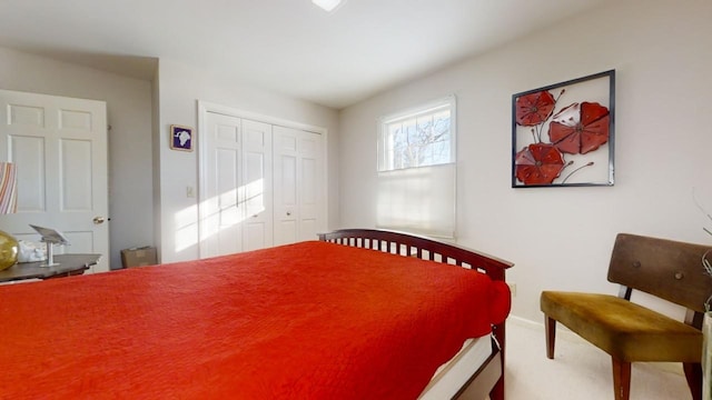 bedroom with a closet and carpet flooring