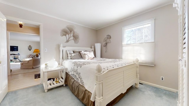 carpeted bedroom featuring crown molding