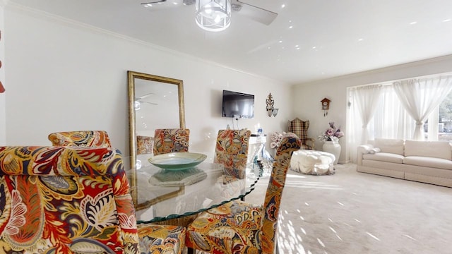 dining area with ornamental molding and ceiling fan