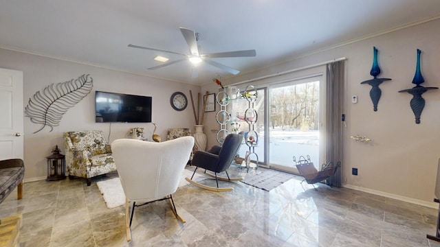 living room with ceiling fan and crown molding