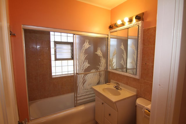 full bathroom featuring vanity, toilet, tile walls, and bathing tub / shower combination