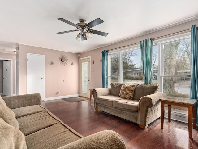 living room with ceiling fan and dark wood-type flooring