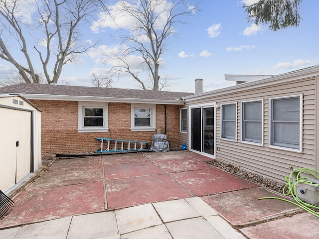 view of patio / terrace with a storage shed