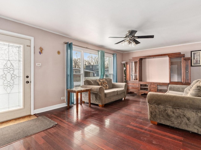 living room with ceiling fan, ornamental molding, and dark hardwood / wood-style flooring