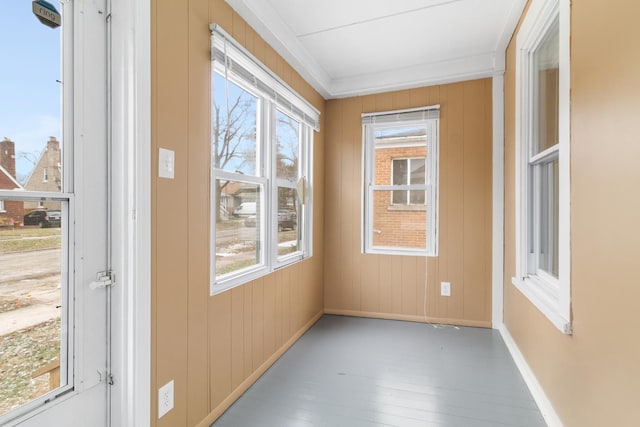 unfurnished sunroom featuring plenty of natural light