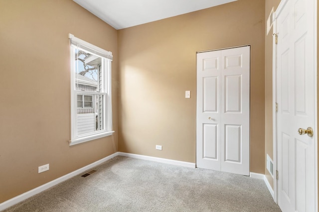 spare room featuring carpet flooring