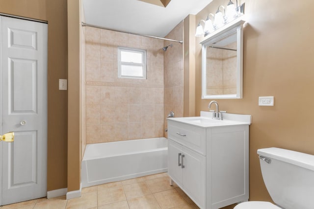 full bathroom featuring tile patterned floors, vanity, toilet, and tiled shower / bath combo