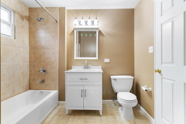 full bathroom featuring toilet, tile patterned flooring, vanity, and tiled shower / bath