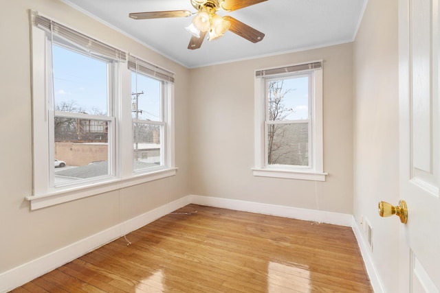 spare room with ceiling fan, light hardwood / wood-style floors, and ornamental molding