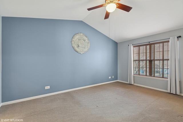 carpeted empty room featuring ceiling fan and lofted ceiling